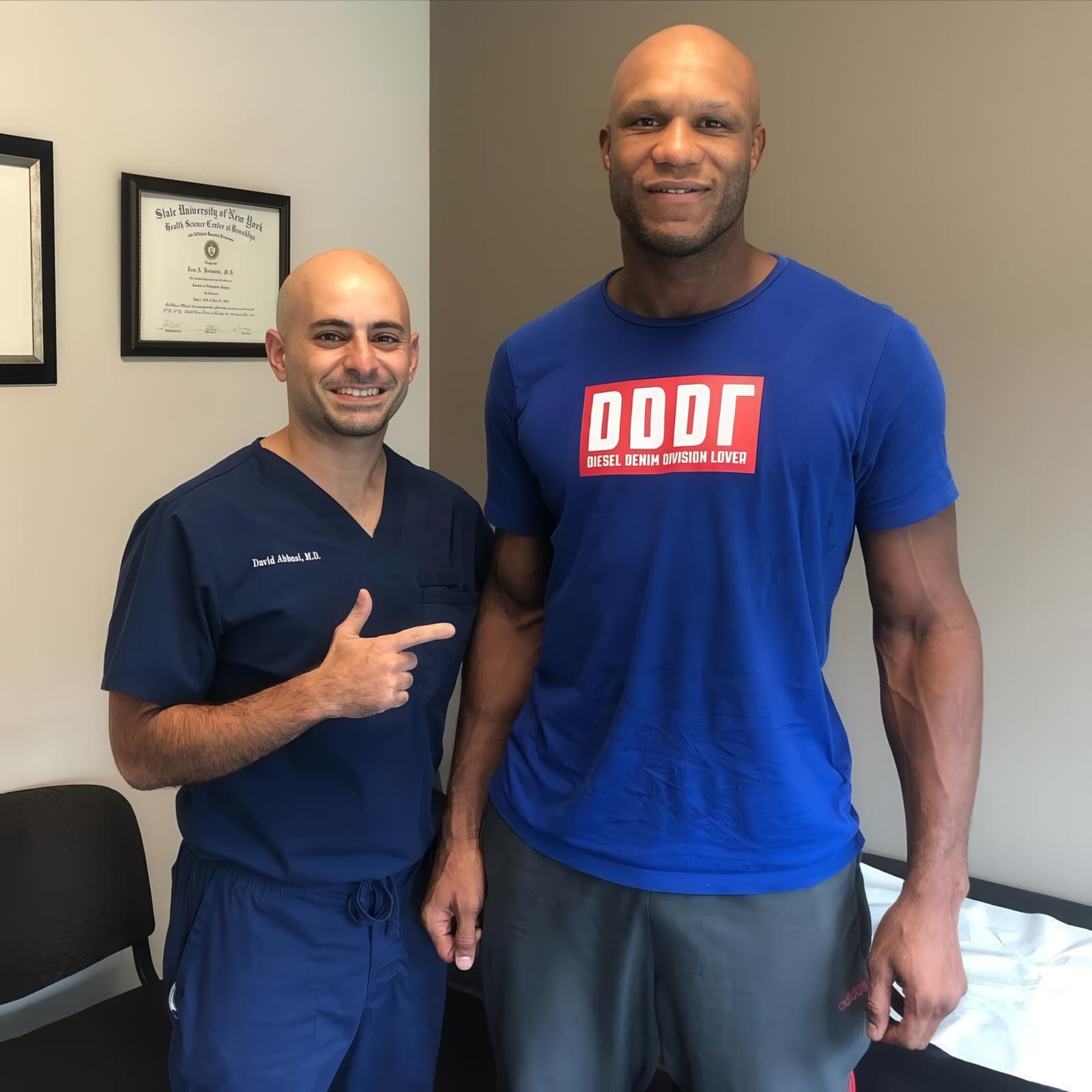 Dr. Abbasi with an athlete in the examination room