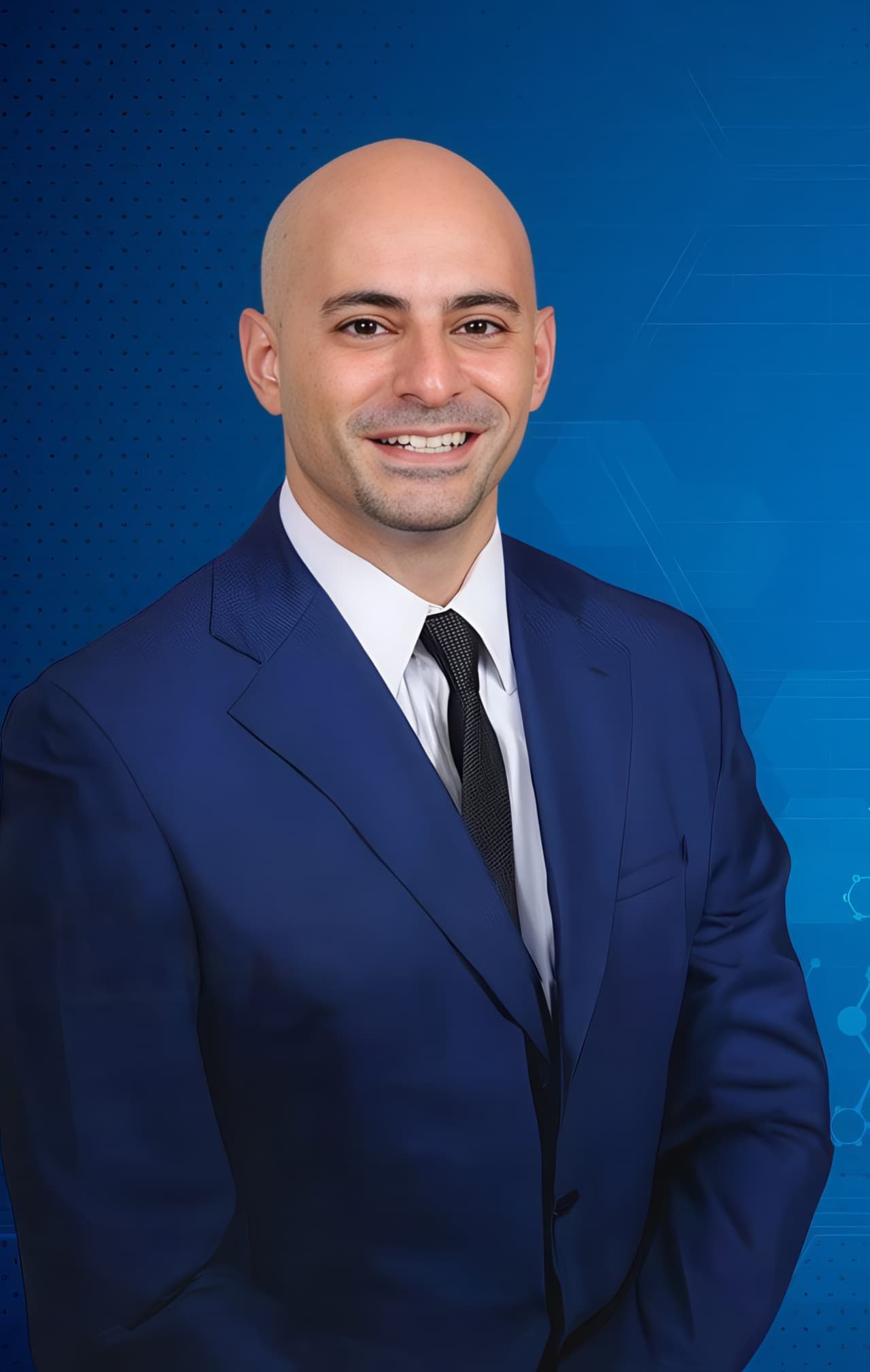 David Abbasi, MD, in a navy suit