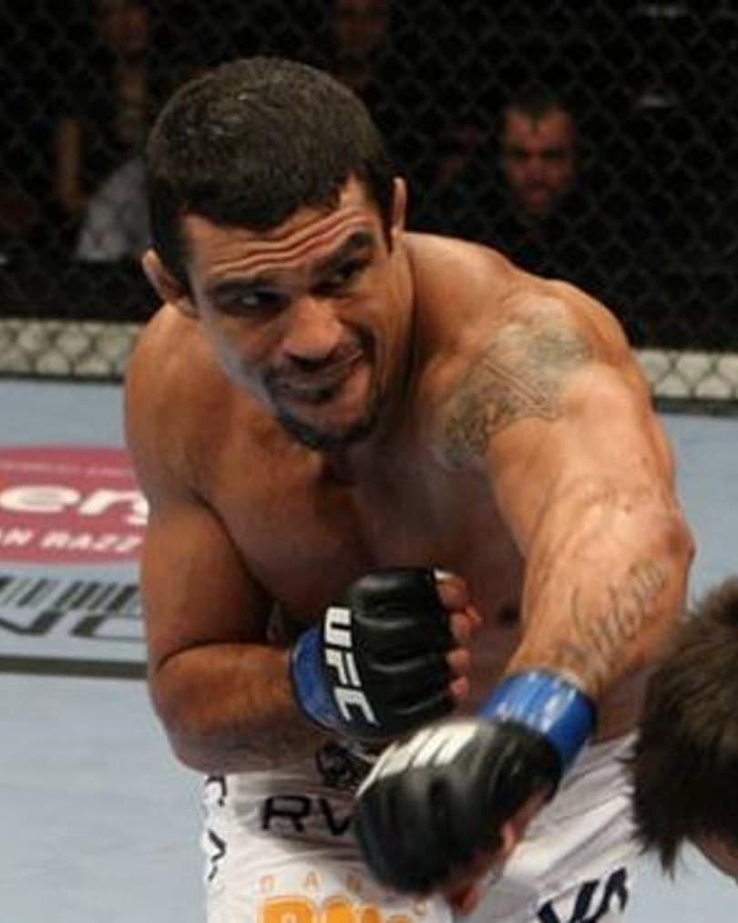 Vitor Belfort throwing a punch in the UFC octagon