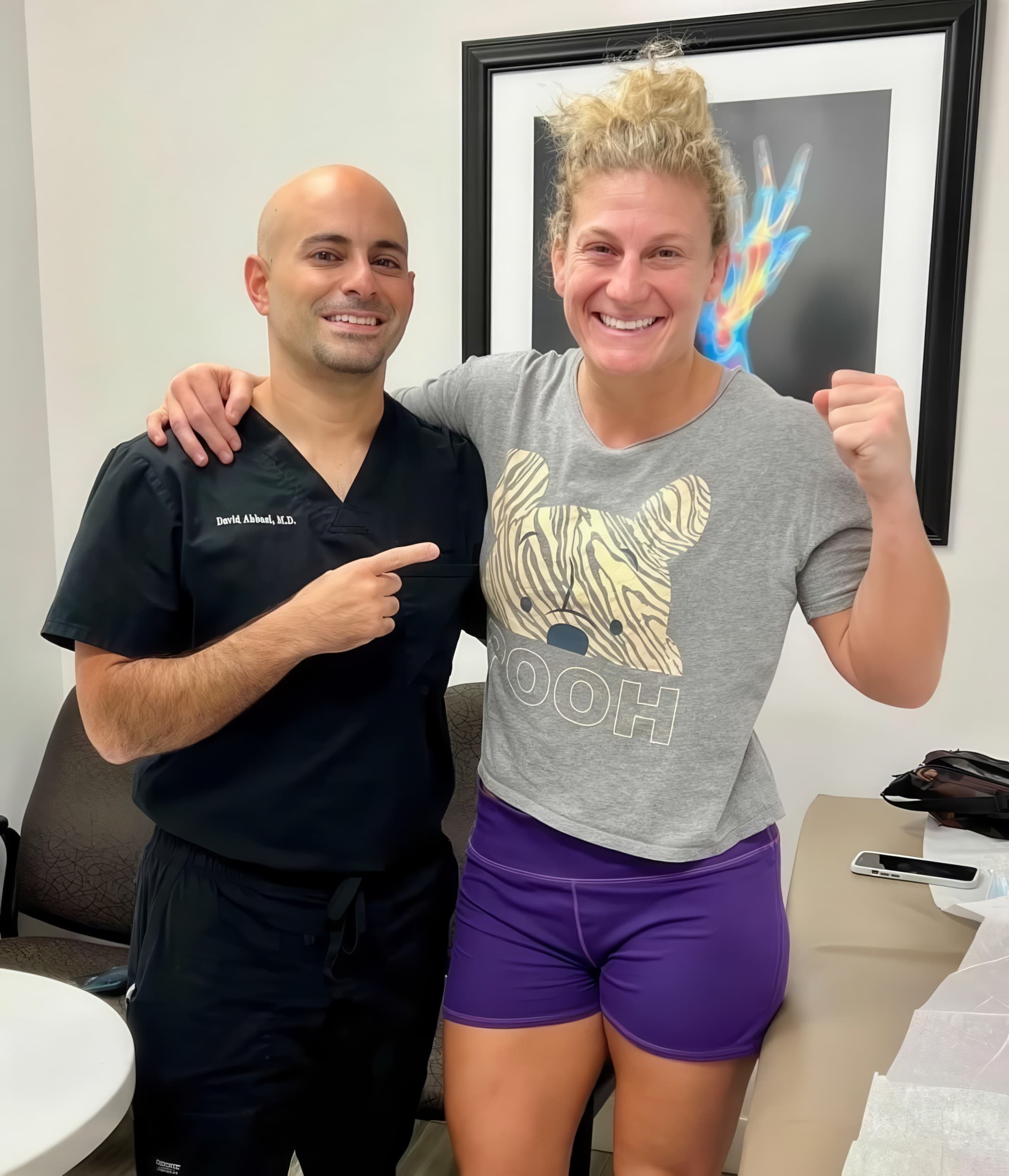 Dr. Abbasi with Kayla Harrison, UFC women’s bantamweight champion and two-time Olympic judo gold medallist